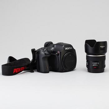 A black body medium format Pentax 645D camera with a SMC Pentax-D FA 645 55mm F2.8 AL [IF] SDM AW lens.