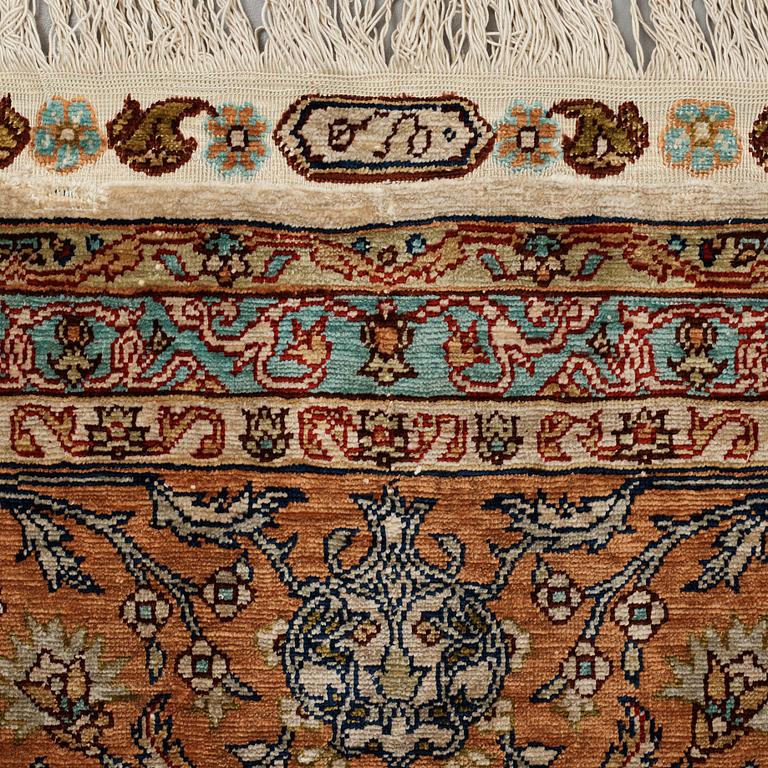 A carpet, an old silk Turkey, ca 237,5 x 146,5  cm (as well as 3,5-4 cm flat weave at the ends).