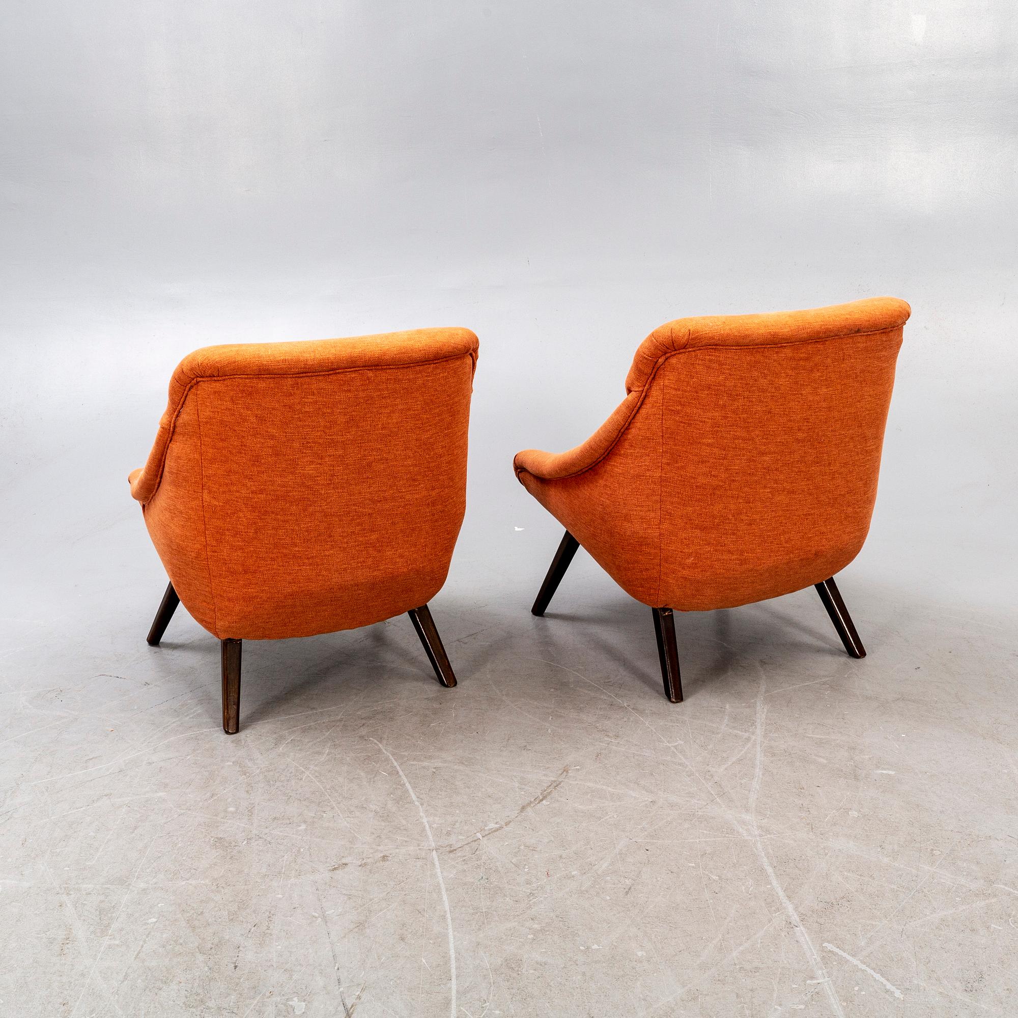 A pair of 1950s easy chairs.
