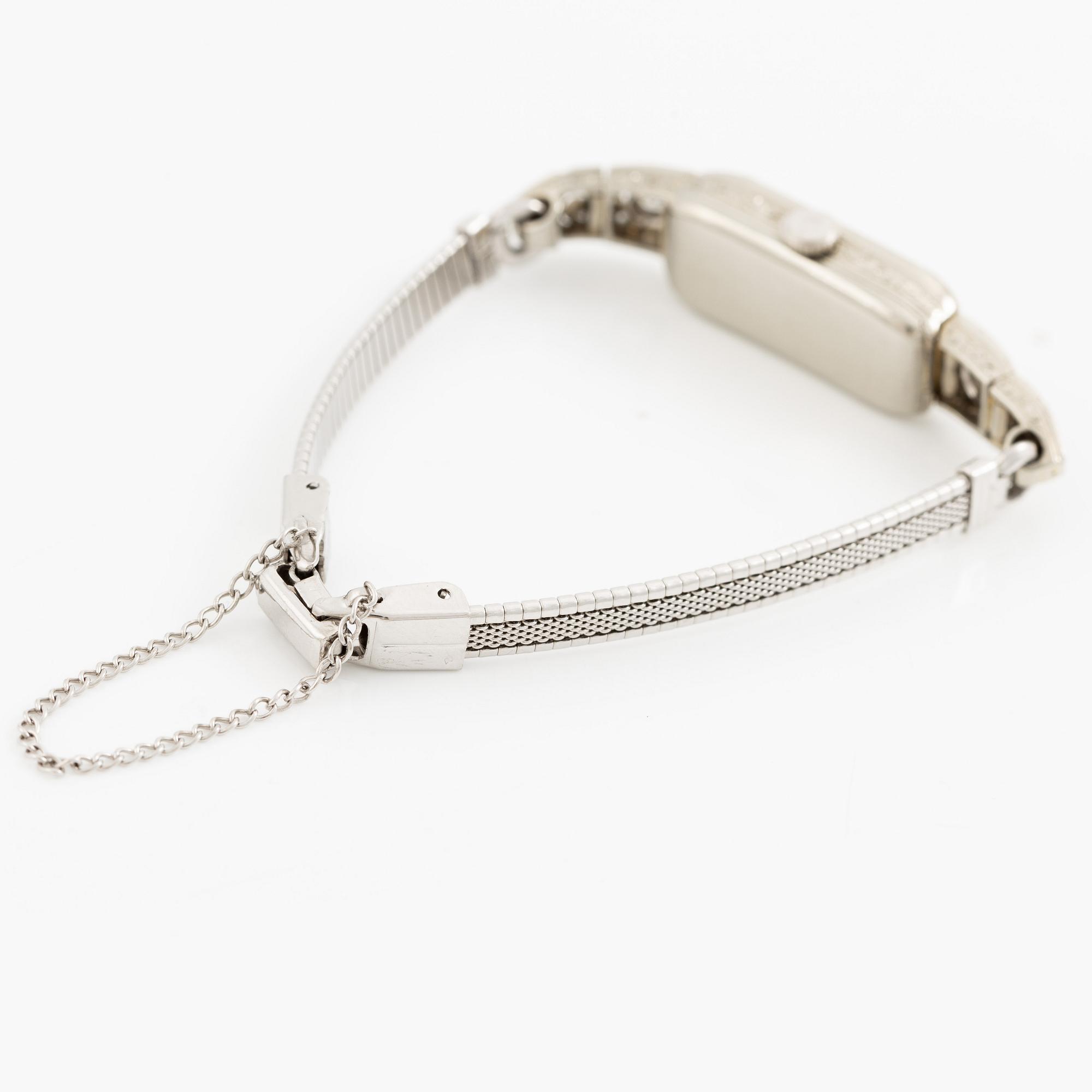 Smyckesur/Aftonklocka, boett 18K vitguld med diamanter.