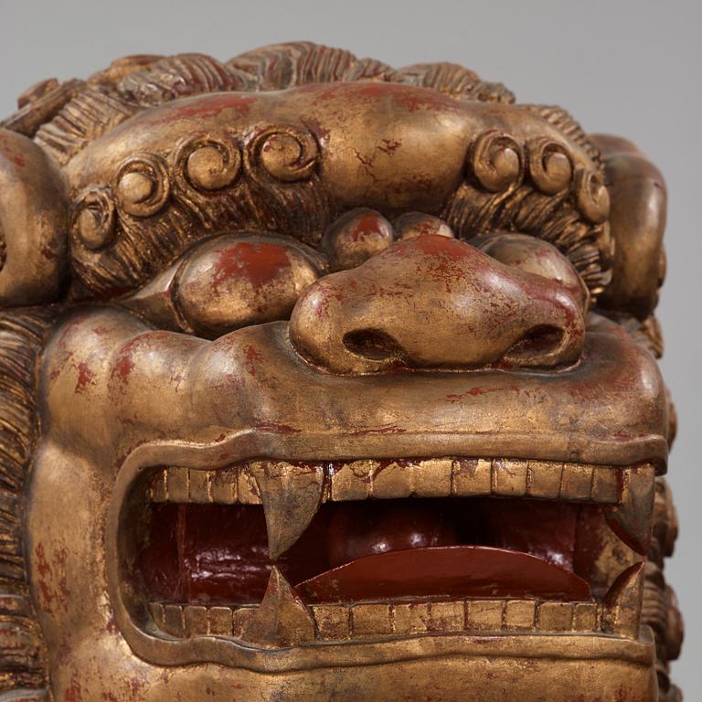 A pair of Chinese massive lacquered Buddhist lions, first half of the 20th Century.