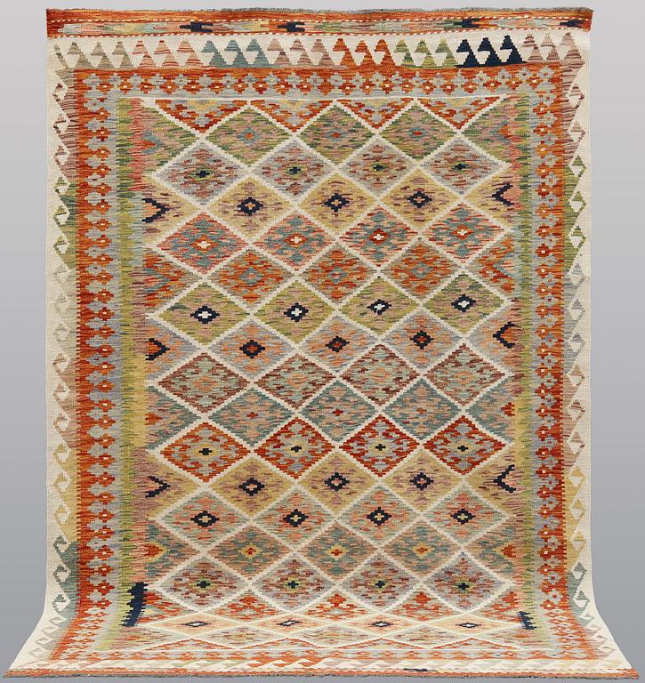 A kilim rug, approx. 250 x 173 cm.