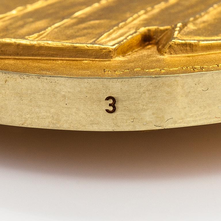 Medalj, Alvar Aalto Finlandia, 18K guld. Design Eila Hiltunen. Kultateollisuus, Åbo 1974. Numrerad 3.