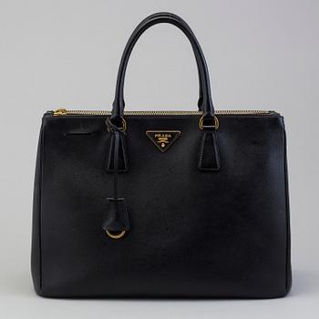 PRADA, a saffiano leather handbag.