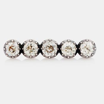 An old-cut diamond brooch set with five diamonds of varying colour. Total carat weight of diamonds circa 8.00cts.