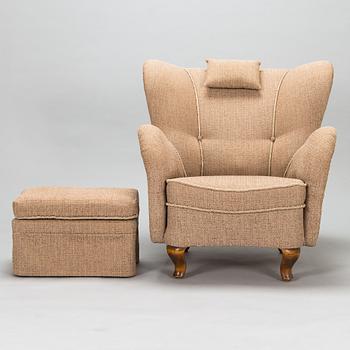 A mid-20th-century armchair and ottoman.