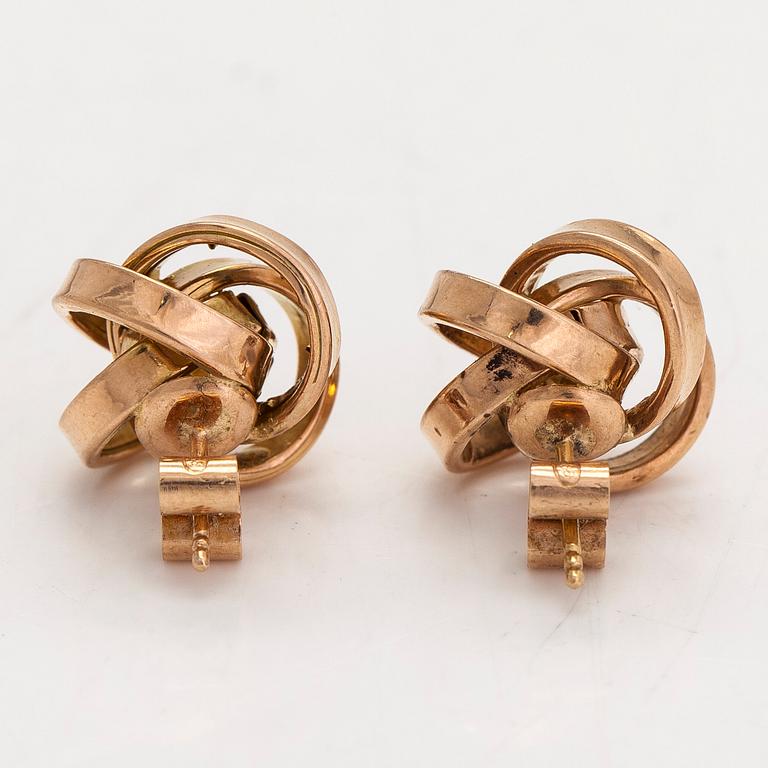 A pair of 14K gold earrings.