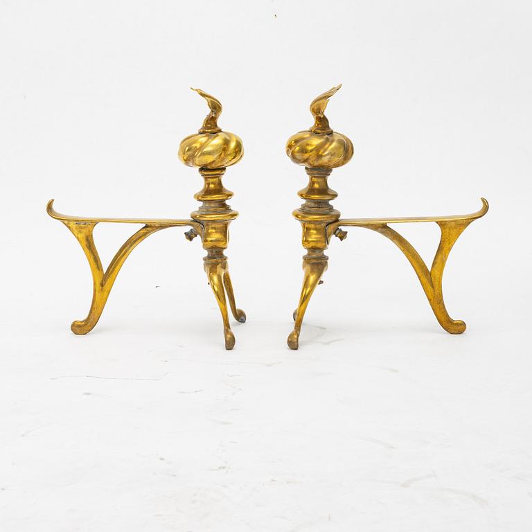 A four piece brass fire set, early 20th Century.