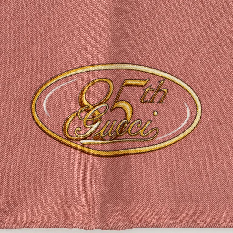 Gucci, a silk scarf.
