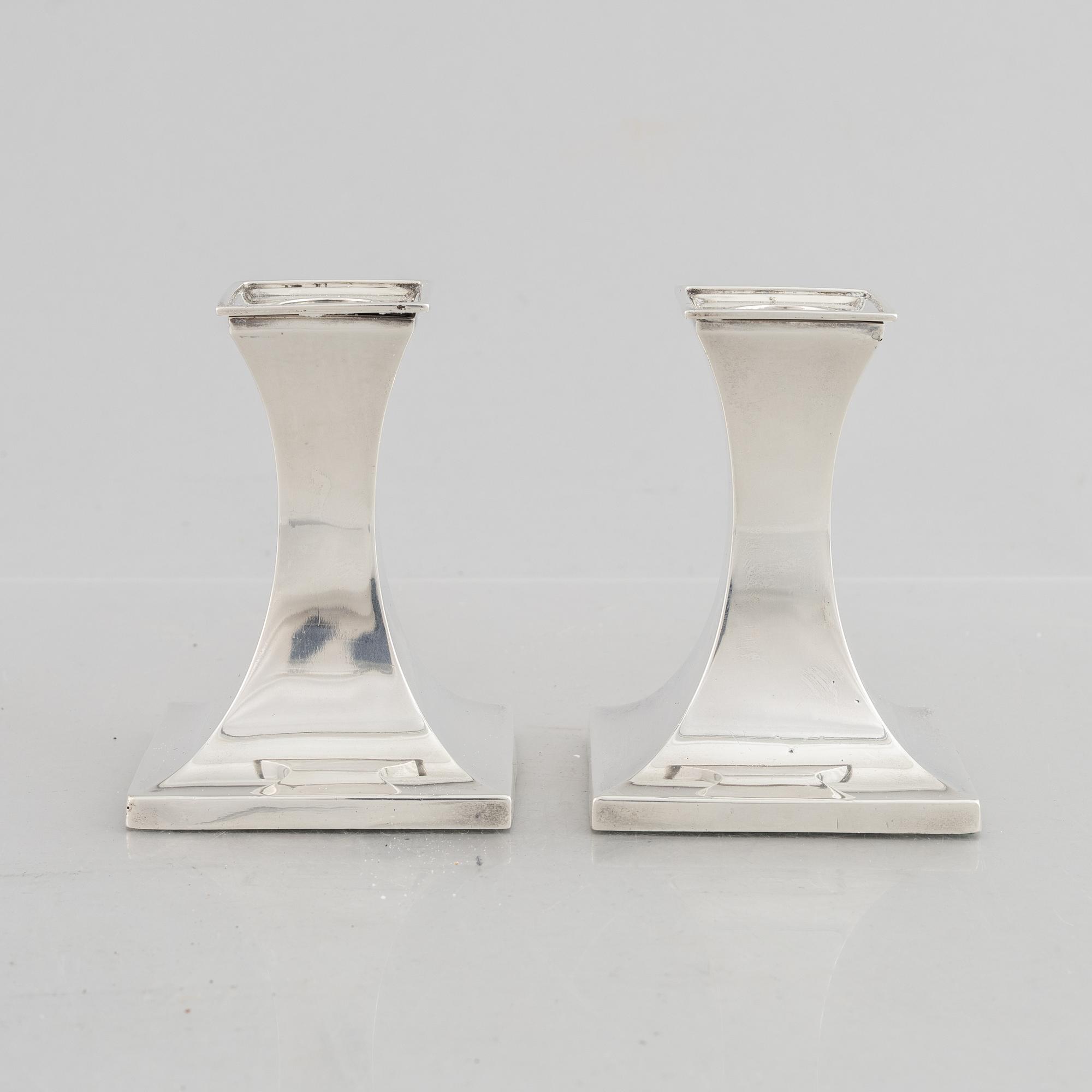 A pair of silver candlesticks, mark of William Hutton & Sons Ltd, Sheffield 1911-1912.