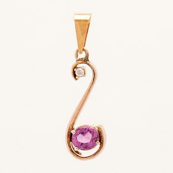 Pendant in 18K gold with an oval faceted pink sapphire and a round brilliant-cut diamond.