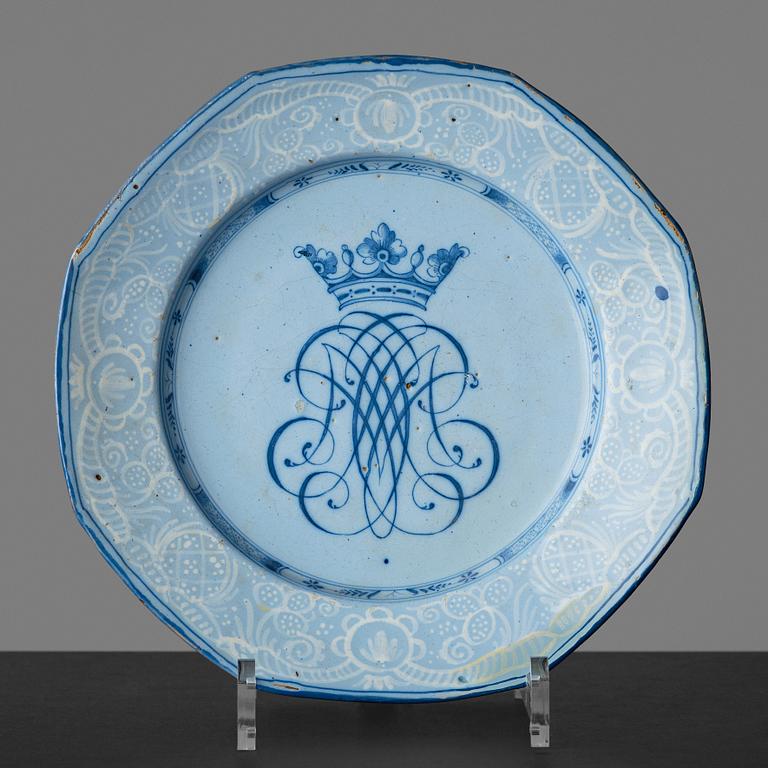 A Rörstrand faience dinner plate, dated Stockholm 15/3 1745.