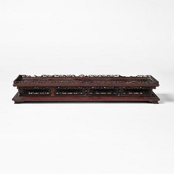 A Chinese hardwood stand, Qing dynasty, 19th century.