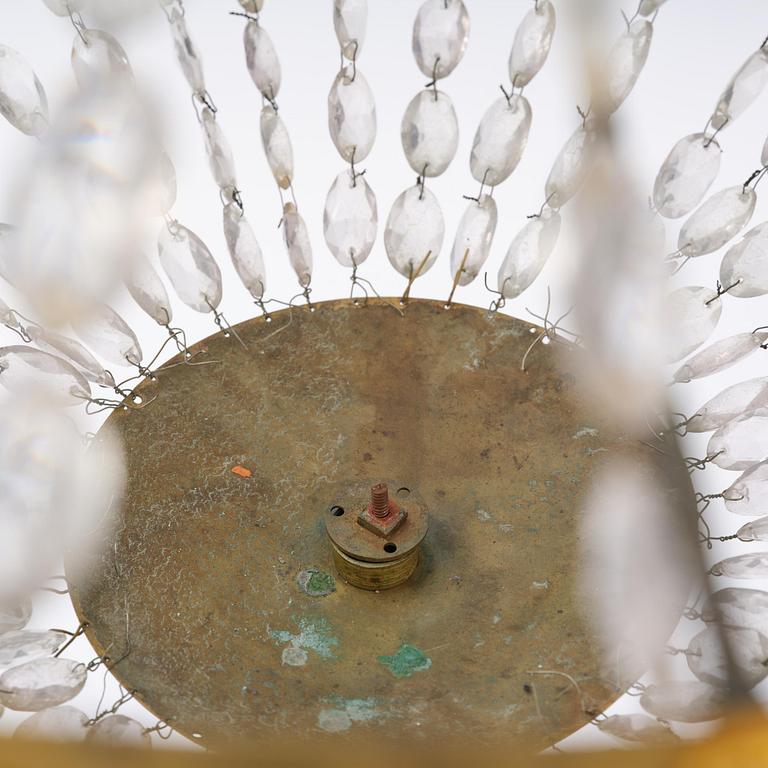 An French Empire eight-light gilt-brass and cut-glass chandelier.