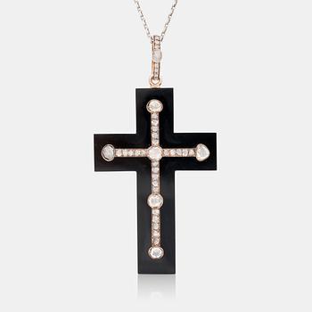 638. A probably Victorian cross pendant set with rose-cut diamonds on onyx.