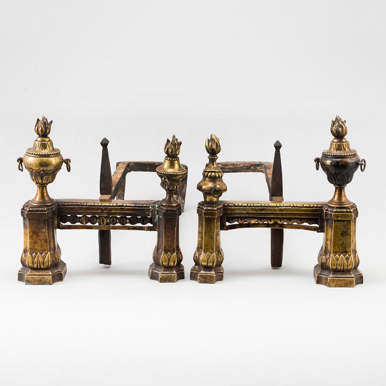 A pair of 19th century Louis XVI style cast iron and brass andirons.