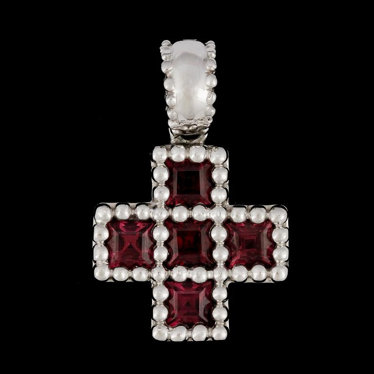 A tourmaline cross pendant.