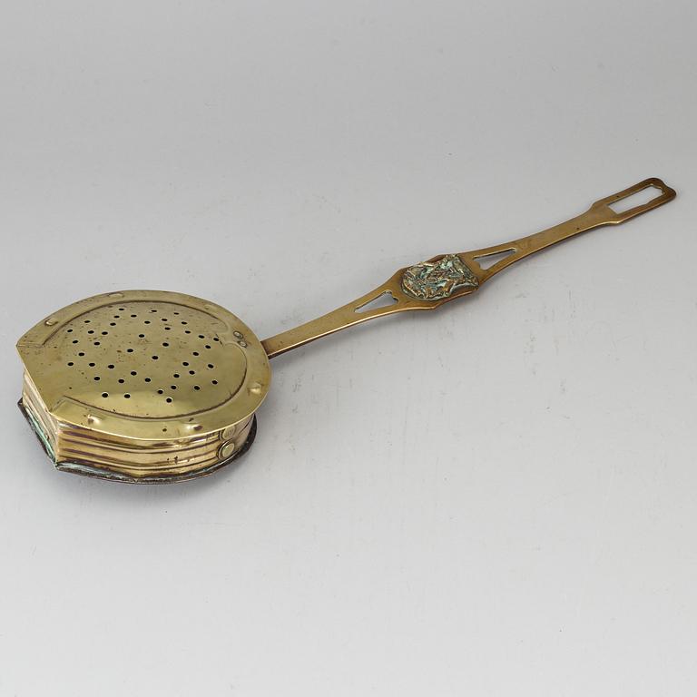 A brass chestnut roaster, 19th century.