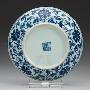 A set of four blue and white lotus dishes, Qing dyanasty with Qianlong sealmark.