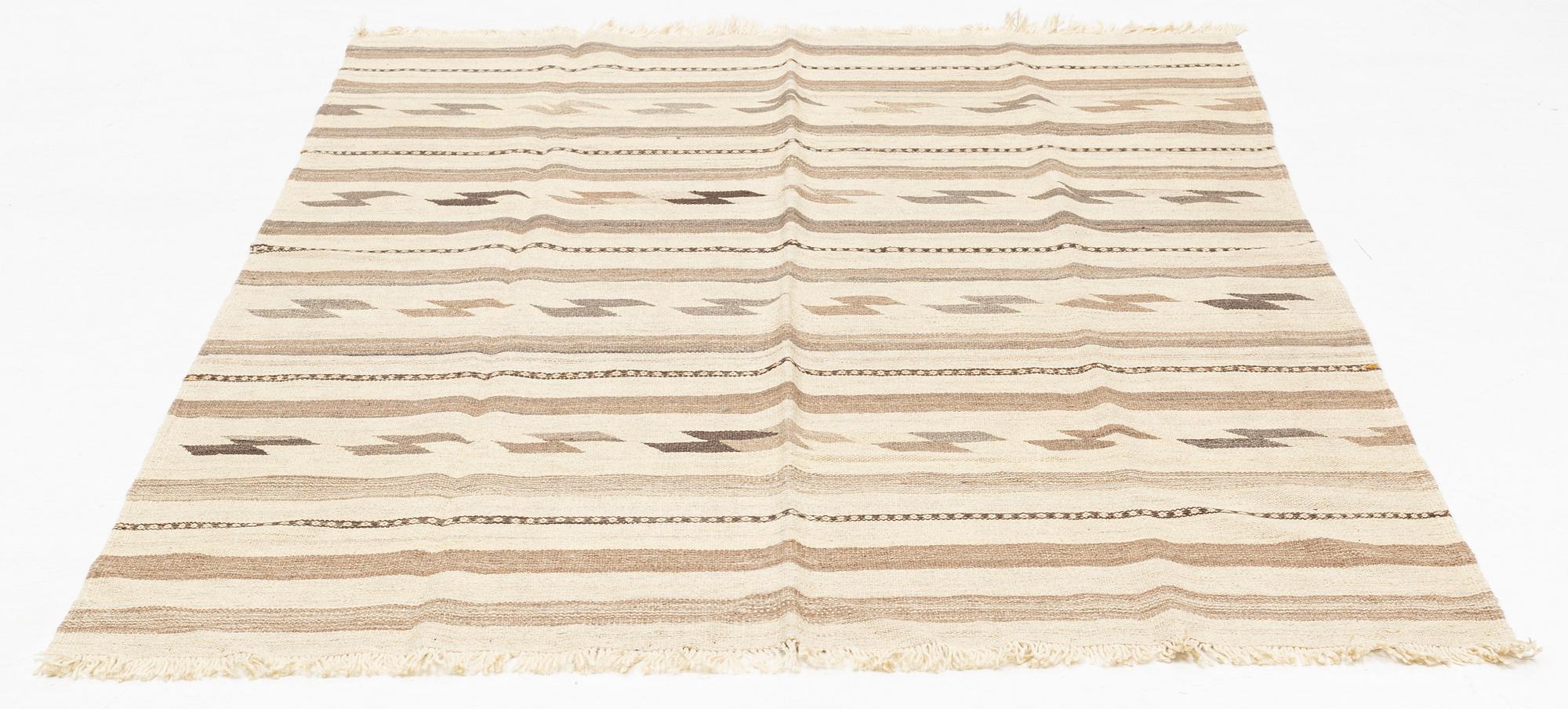 A kilim rug, approximately 245 x 162 cm.