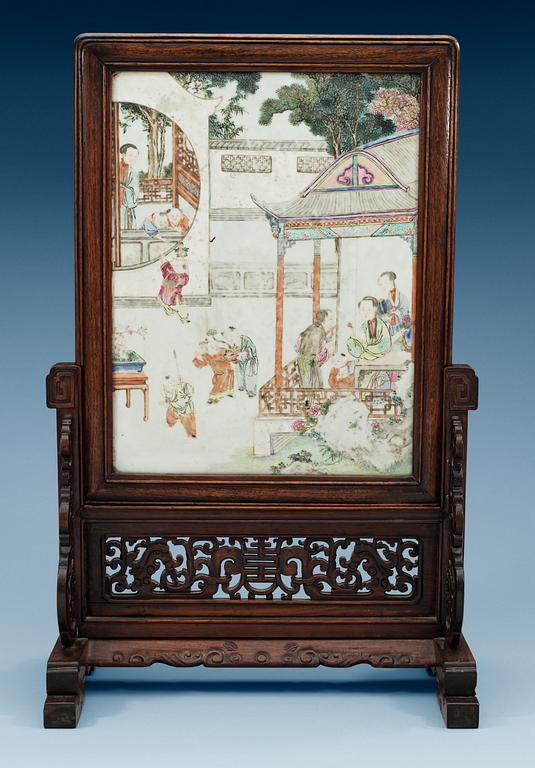 A famille rose screen on a wooden stand, Qing dynasty, 19th Century.