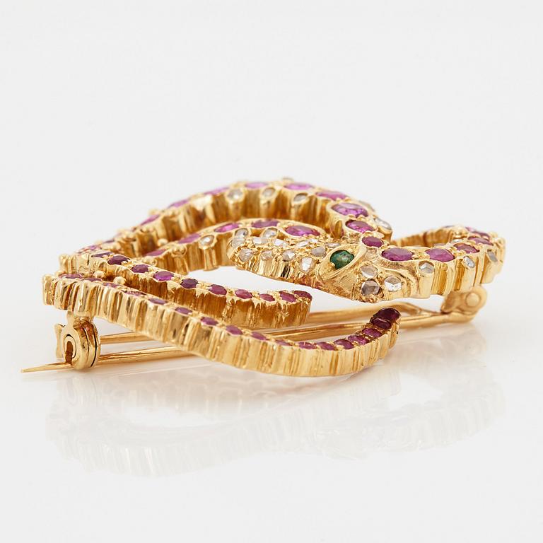 Ilias Lalaounis brosch 18K guld med fasettslipade rubiner, en smaragd och rosenslipade diamanter.