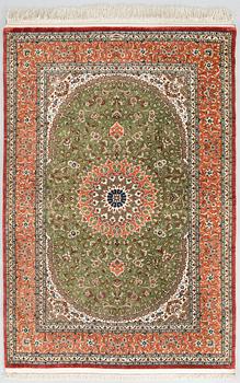 A silk Qum rug, circa 152 x 101 cm.
