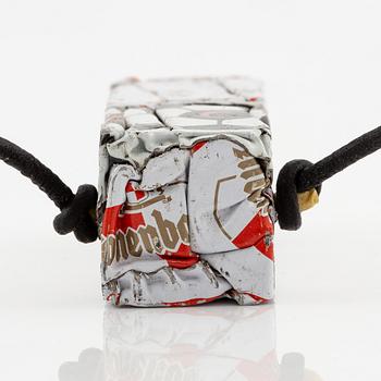 César Baldaccini, compression, pendant made of compressed beer bottle caps.