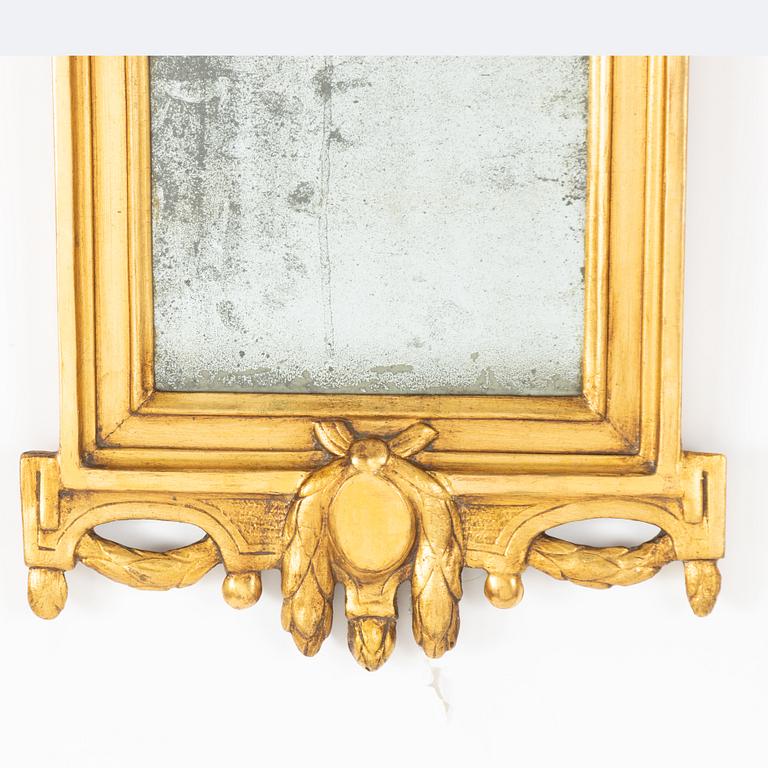 A Gustavian giltwood mirror by C. G. Fyrwald (master in Stockholm 1776-1825).