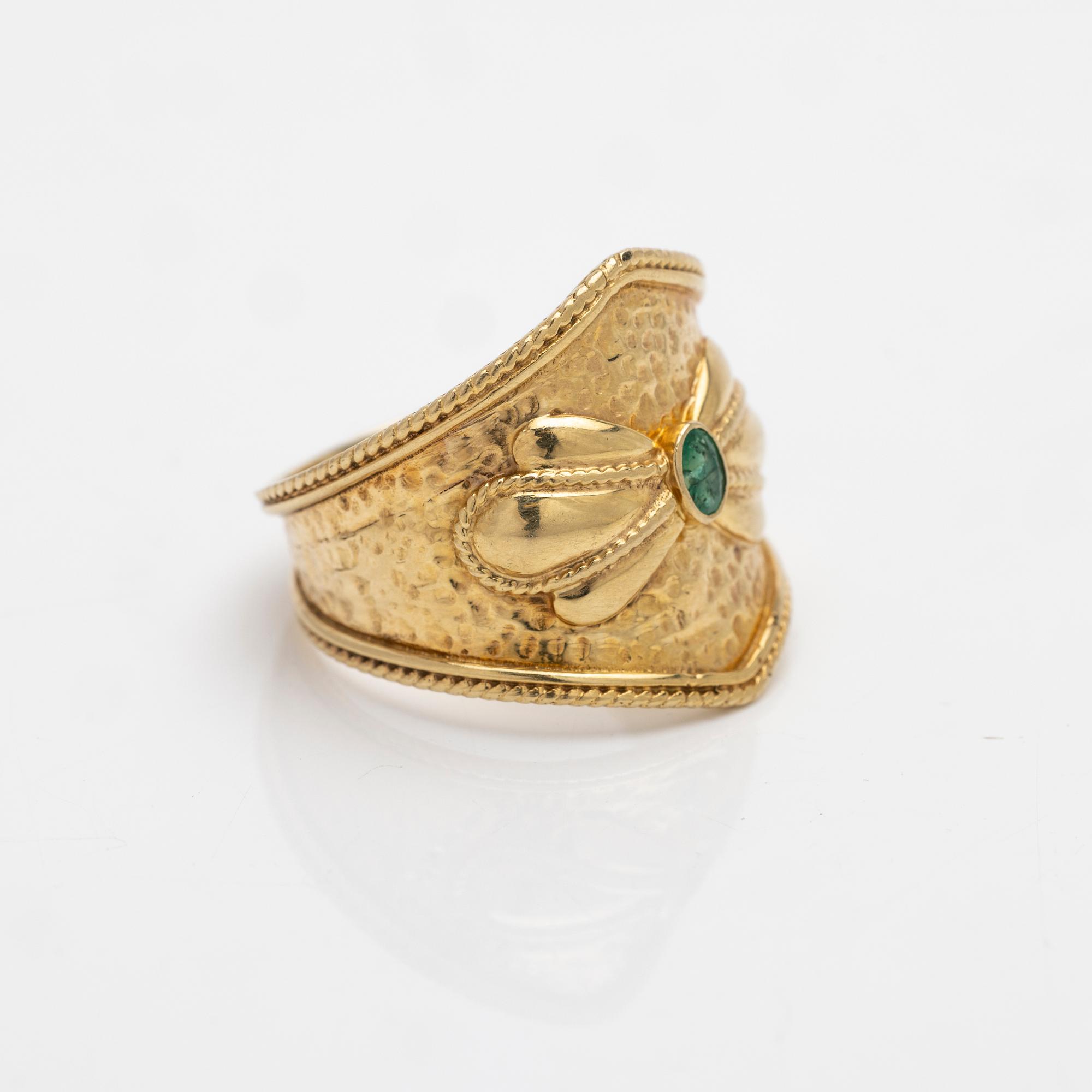 14K gold ring with an emerald.