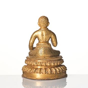 A gilt copper alloy figure of a Lama, most likely Sonam Tsemo, Tibet, probably 16/17th century.