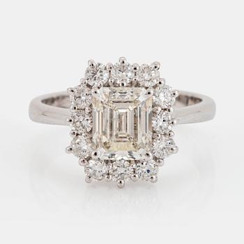 1063. An 18K gold ring set with an emerald-cut diamond 2.04 cts quality J vs1.