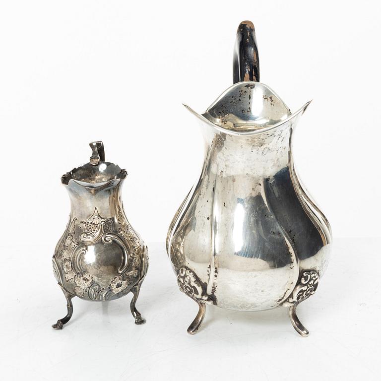 Two silver jugs, one English.