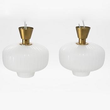 A pair of glass and brass Swedish Modern ceiling lights, Böhlmarks, 1940's.