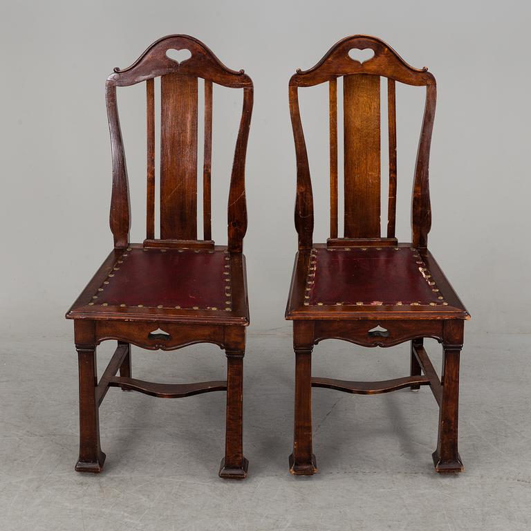 A late 19th century dining table with ten chairs and five extension leaves.