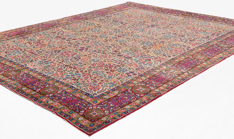 An antique 'Millefleur' Kerman Laver carpet, ca 434 x 321 cm.