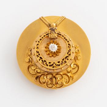 Brooch 18K gold with an old-cut diamond.