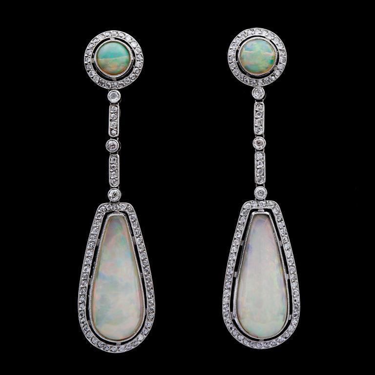 A pair of opal, tot. 7.27cts, and diamond earrings, tot. app. 1.90 cts.