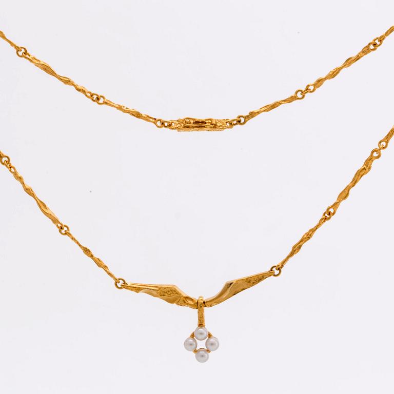 LAPPONIA, parure, 18K gold and cultured pearls approx 3 mm, design Björn Weckström 1999, certificate and original box.