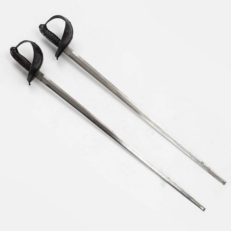 A Swedish pair of military practice swords 1886 pattern.