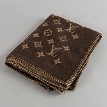 A blancet by Louis Vuitton.