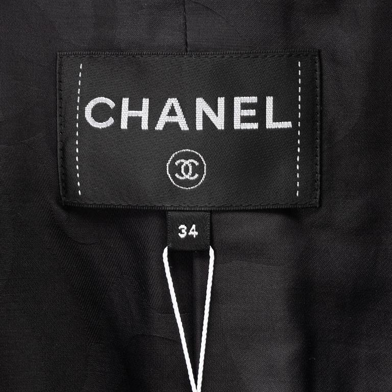 Chanel, A black bouclé jacket, size 34.