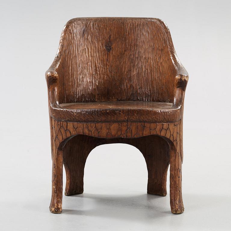 A Gustaf Fjaestad Art Nouveau carved pine chair, 'Stabbestol', by Adolf Swanson, Arvika, Sweden 1908.