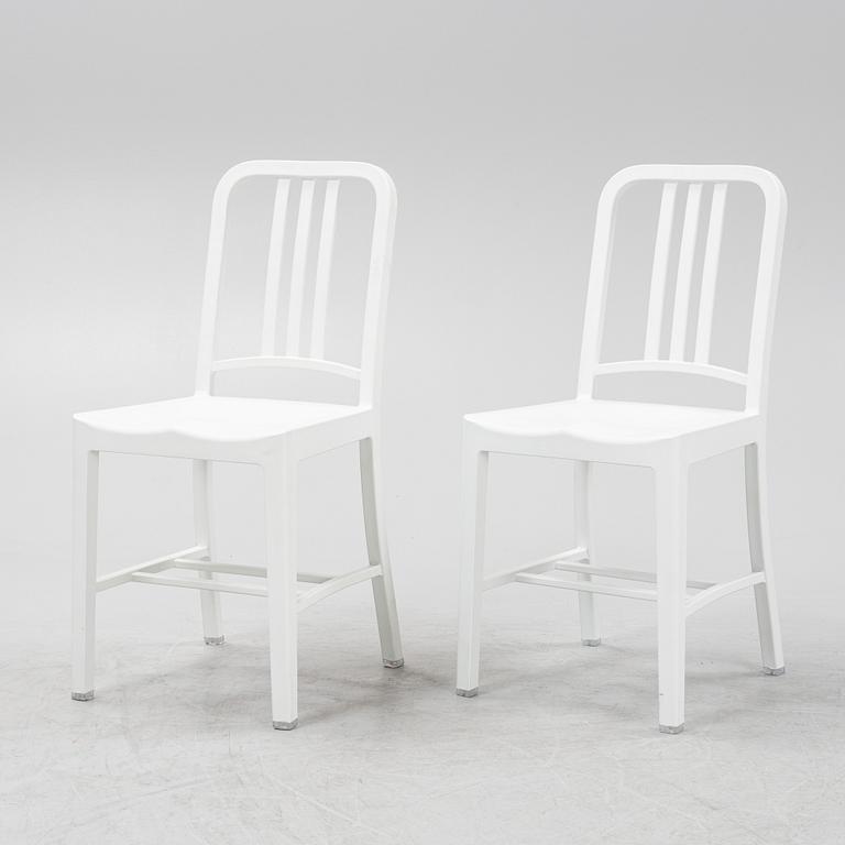 A pair of plastic 'Navy Chair' by Emeco.
