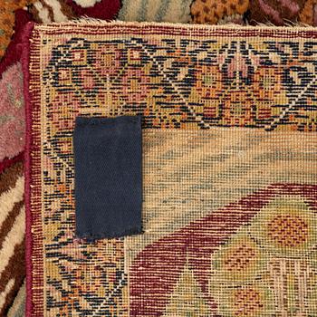 A Persian Kerman Laver 'Mashahir' ('The rulers of the world') rug, c. 82 x 63 cm.