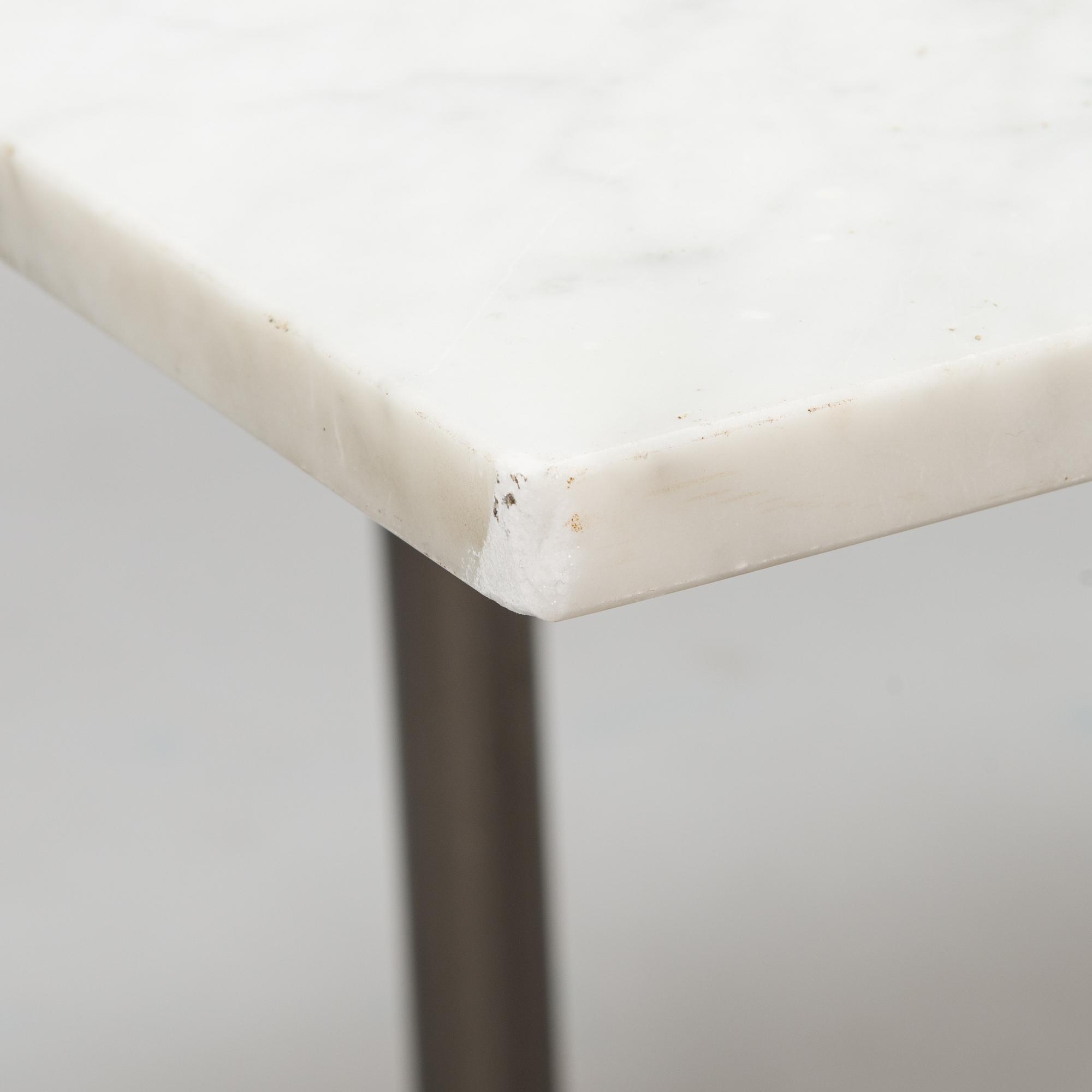 A marble top table, 21th century.