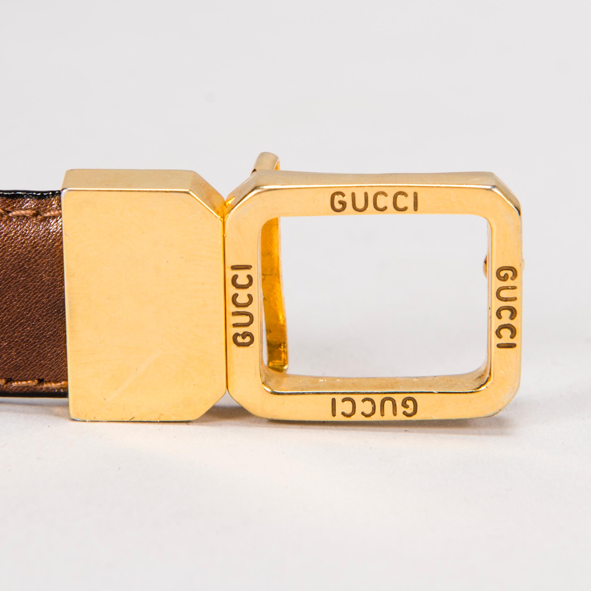 GUCCI Silk Blouse and a Leather Belt.