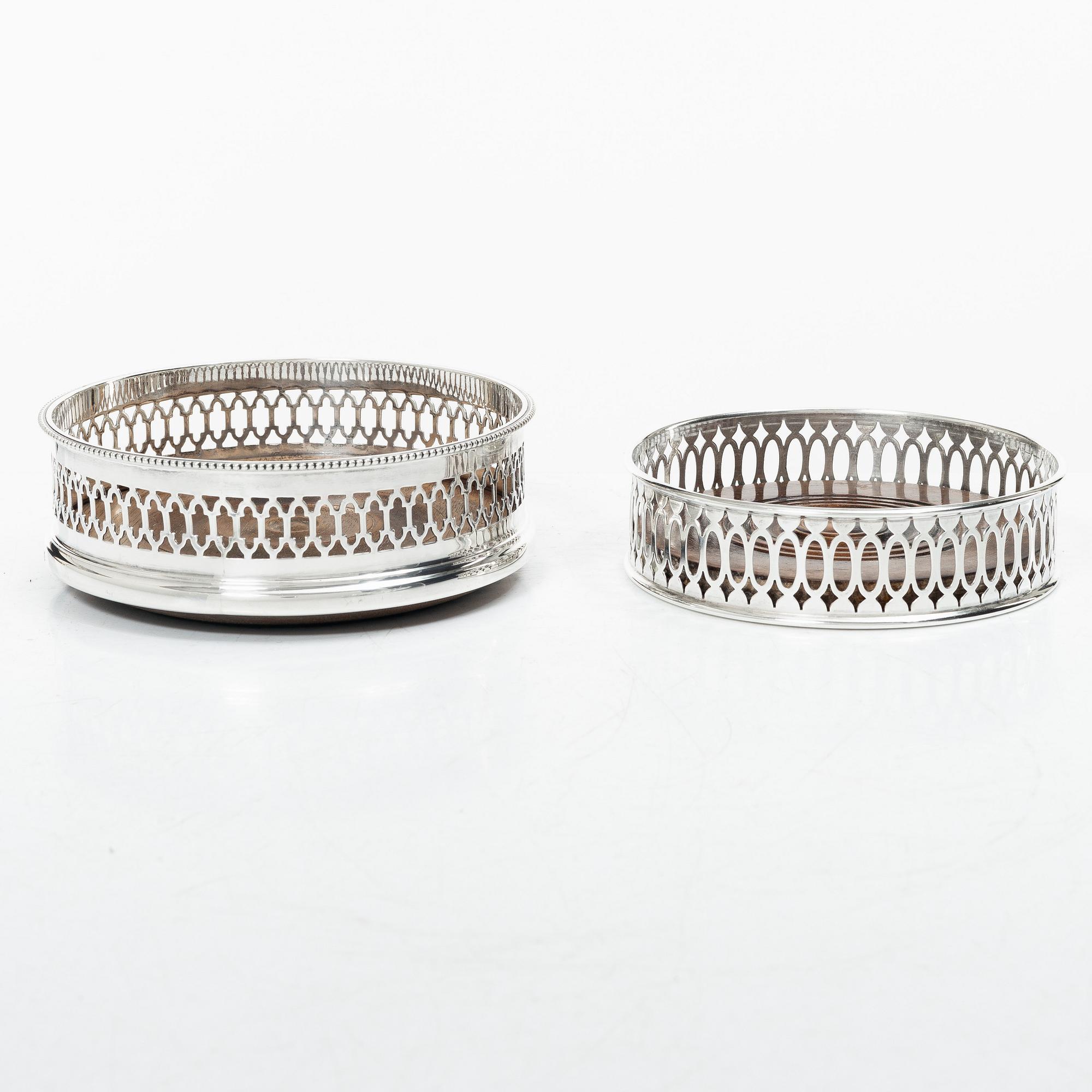 Two English silver coasters, mark of E Edmonds, Birmingham, 1930 and C J Vander Ltd, London 1969.