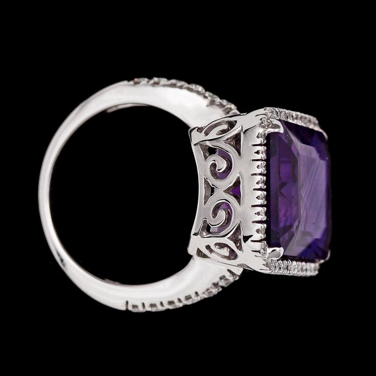 RING, step cut amethyst, 13.48ct, and brilliant cut diamonds, 0.58 cts.