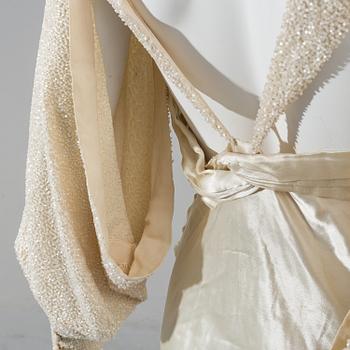 A satin wedding dress, circa 1935.